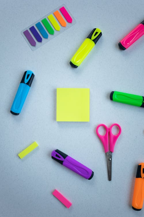 Free Colored Marker and Scissors on White Surface Stock Photo