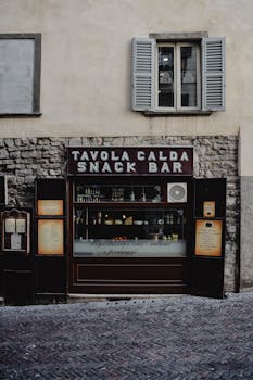 Rustic snack bar in Bergamo, showcasing traditional facade and Italian charm.
