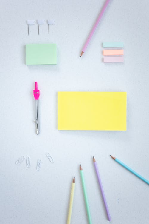 Variety of Stationery Items on White Surface