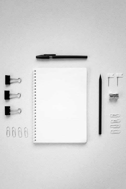 Arranged School Supplies on White Surface