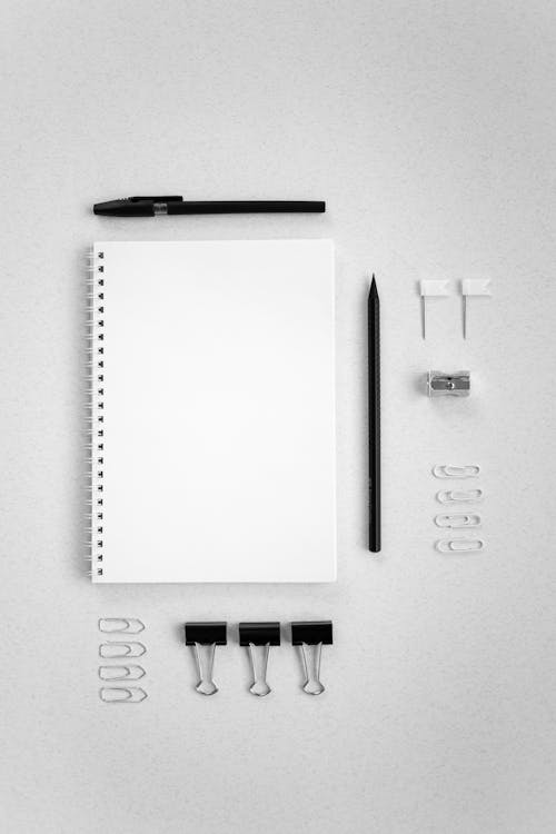 Stationery and Office Supplies on a White Surface