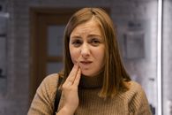 Woman With Hand on Her Cheek