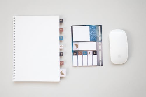 Free Notebook with Sticky Notes and an Apple Magic Mouse Stock Photo
