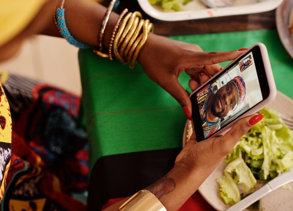 man and woman smiling during video call while dating online