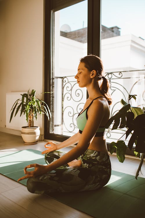 Free A Woman in Lotus Position Meditating Stock Photo