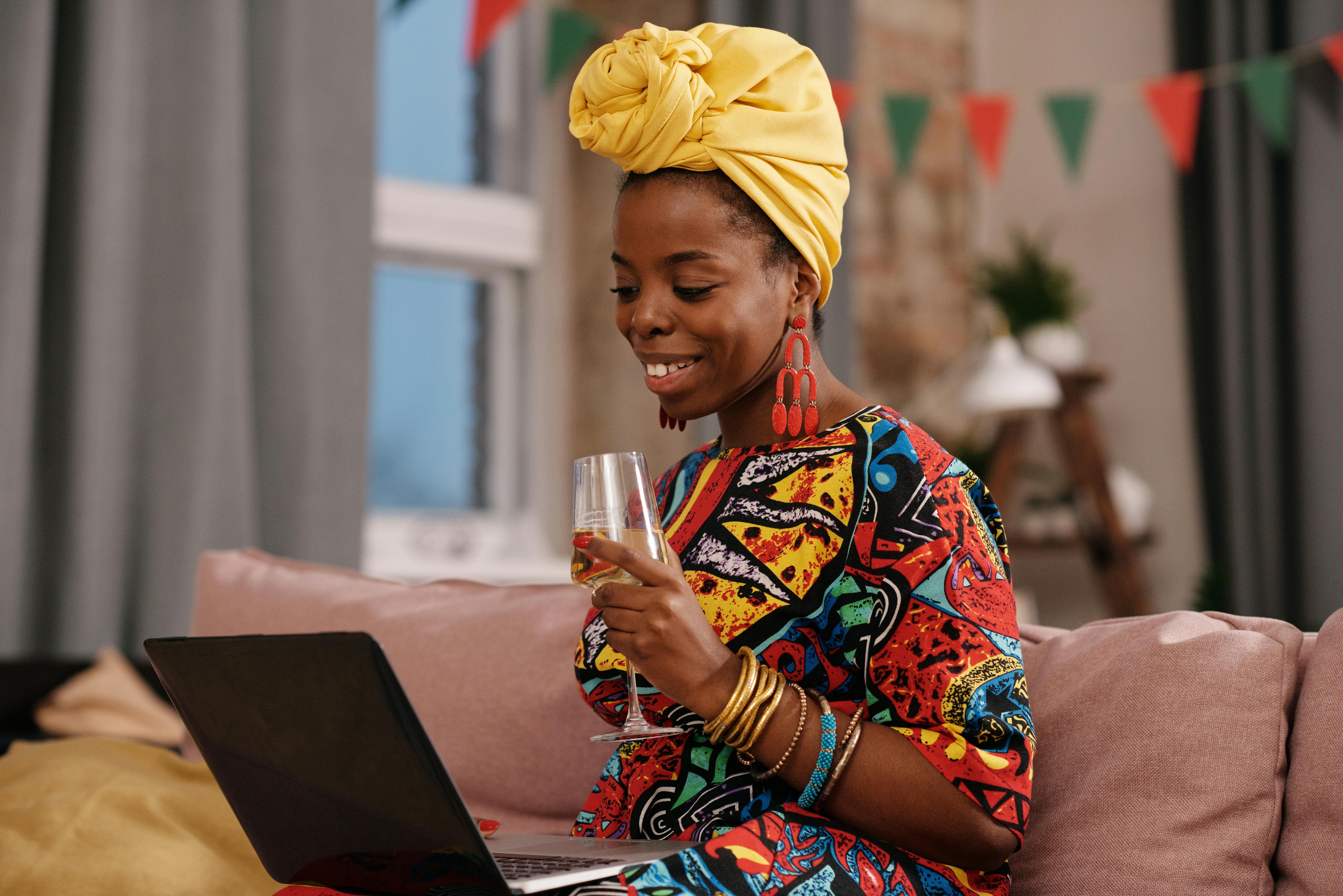 photo of woman looking on her laptop