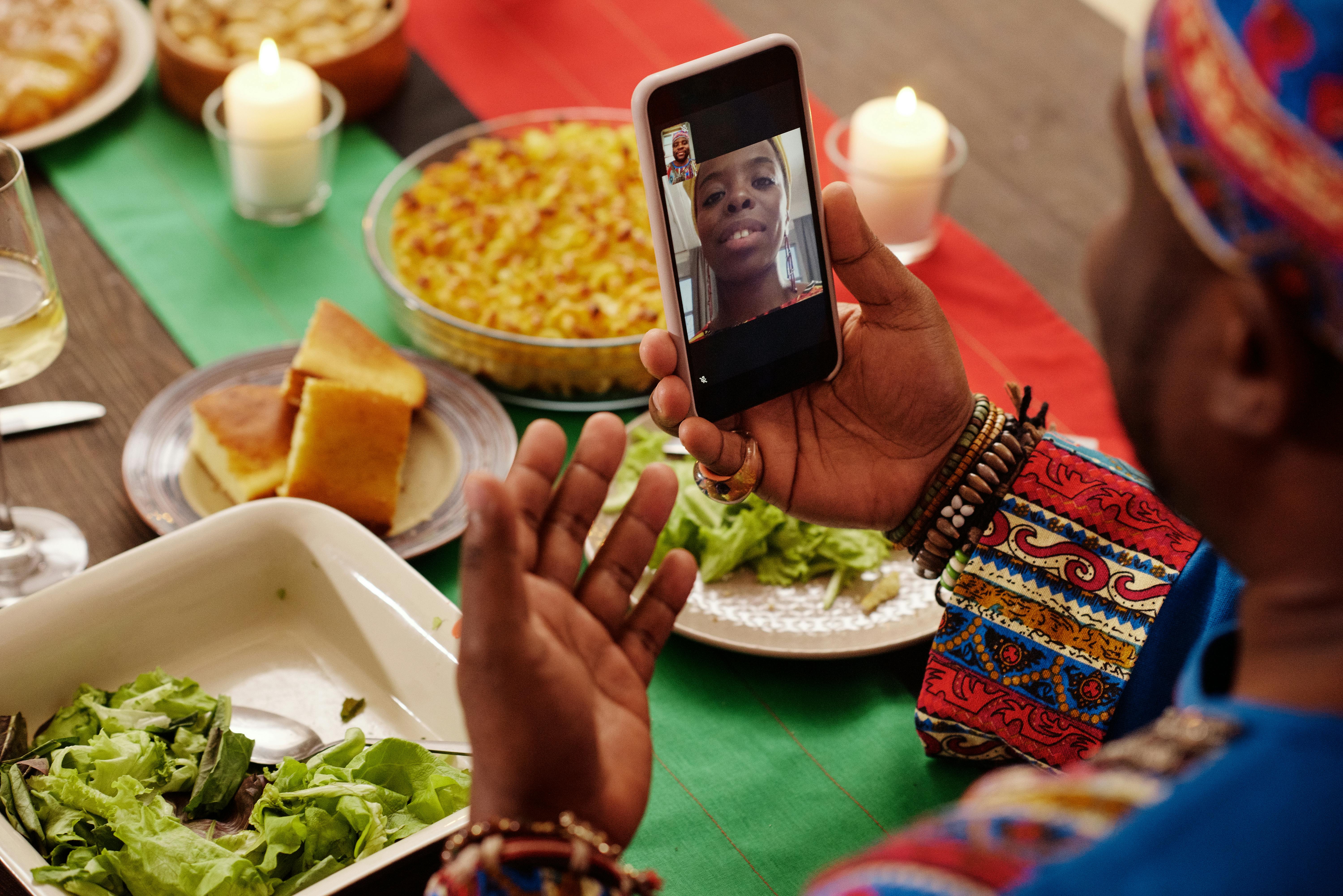 photo of people talking to each other through smartphone