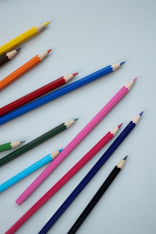 Free Assorted Colored Pencils on White Surface Stock Photo