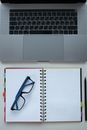 Framed Eyeglasses on a Notebook