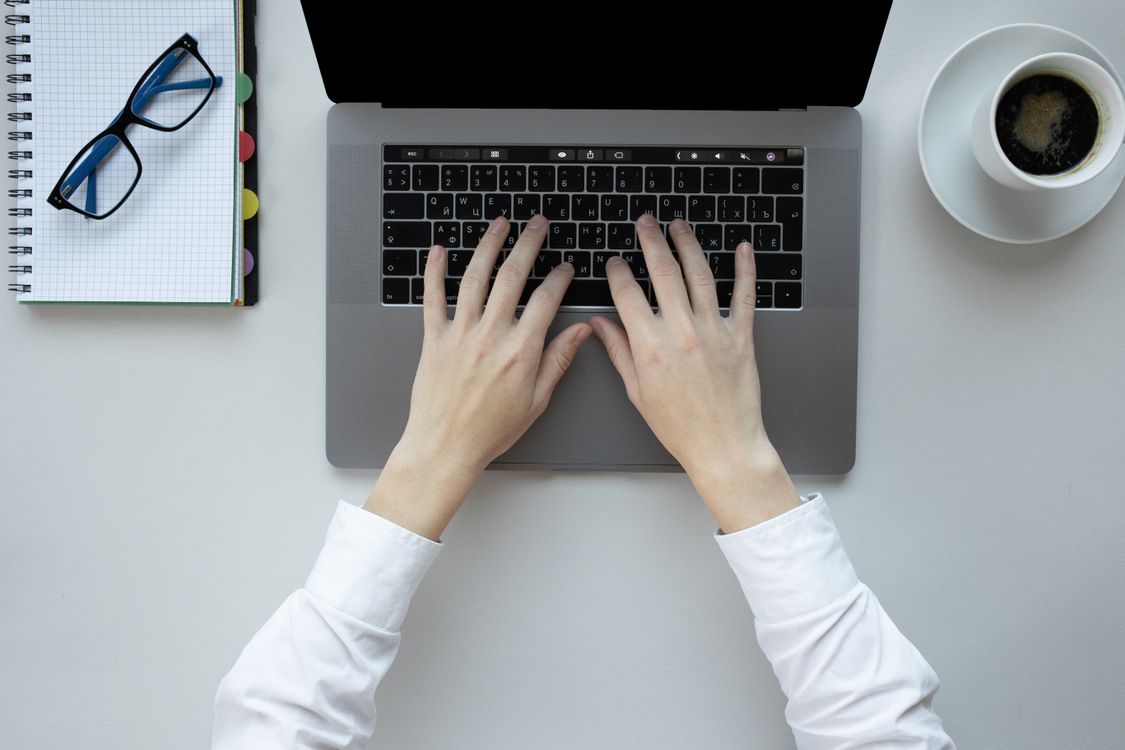 Person Typing on a Laptop · Free Stock Photo