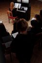 People Sitting on Brown Wooden Chairs