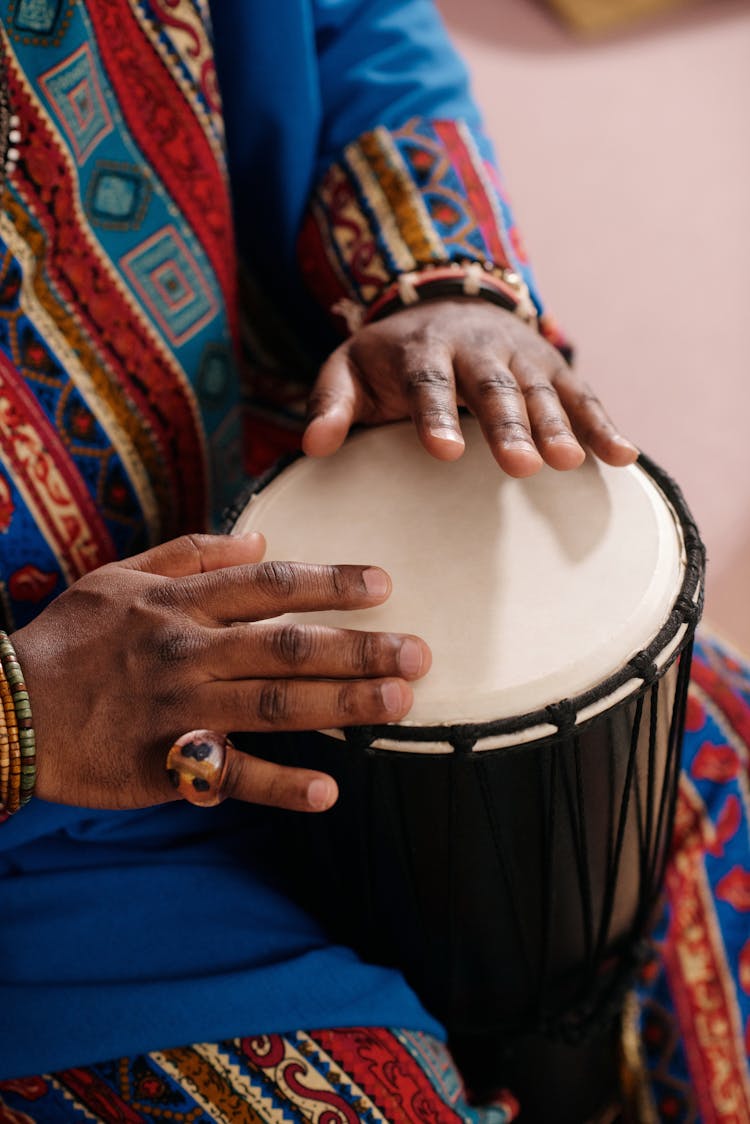 Photo Of Person Playing Djembe