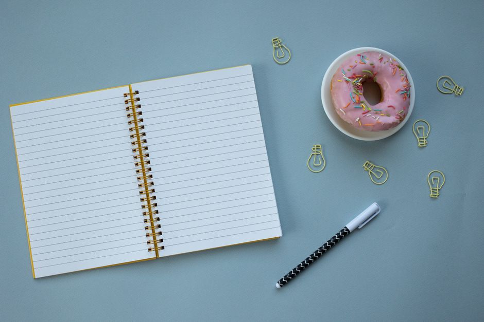 notebook and pen on desk real home lifestyle photo 1