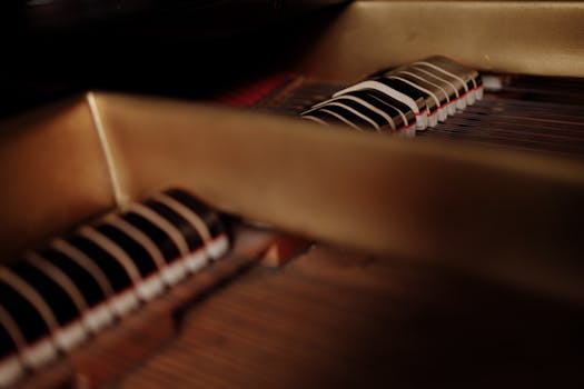 Detailed view of piano strings and hammers, showcasing intricate mechanics.