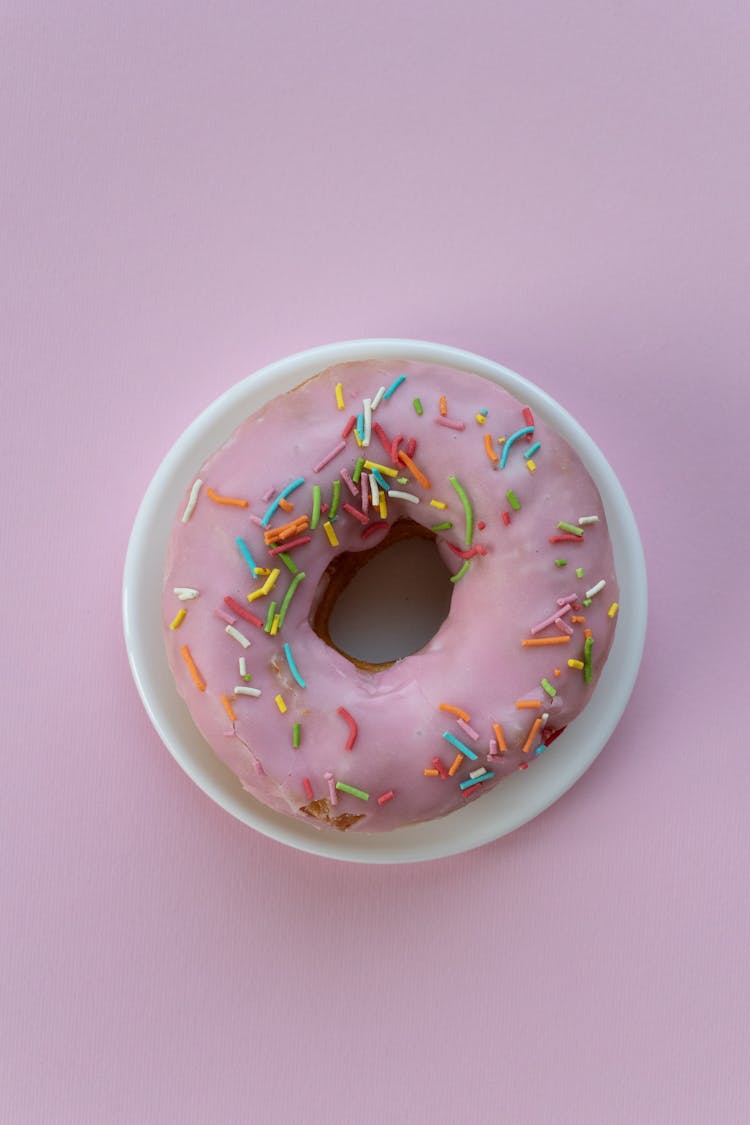 Donut With Sprinkles On Small Plate