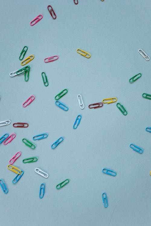 Colorful Paperclips on a Blue Background