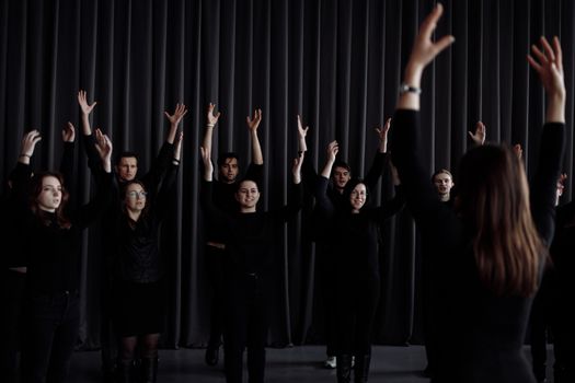 Group of People with Their Arms Raised