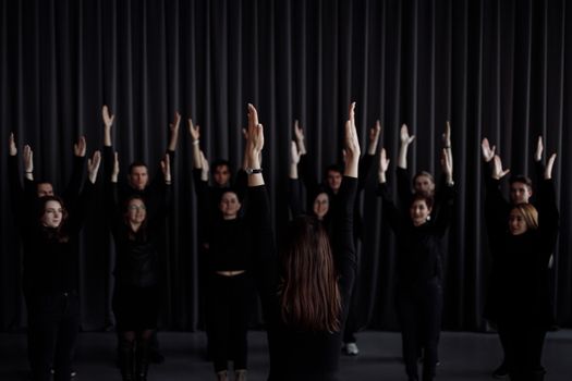 Group of People with Arms Raised