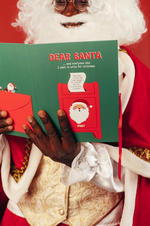 Free Santa Claus Reading a Christmas Card Stock Photo