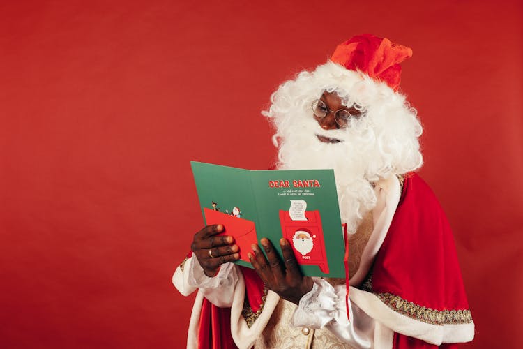 Santa Claus Reading A Christmas Card