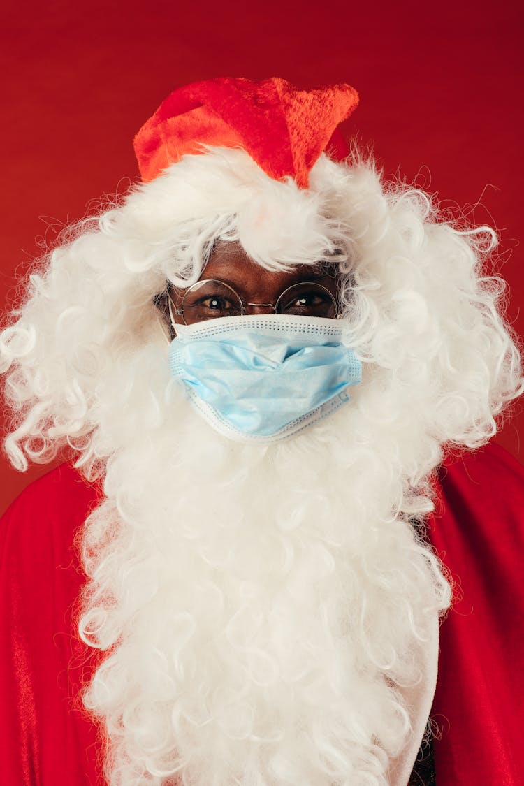 Man In Santa Outfit With Face Mask