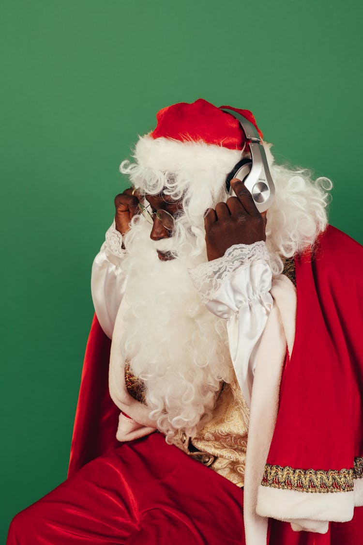 Santa Claus Listening To A Music