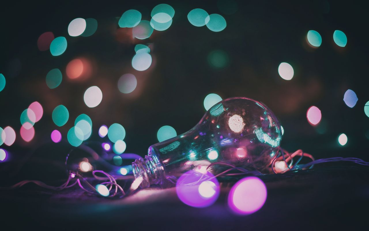 a mesmerizing bokeh effect with a light bulb surrounded by colorful li