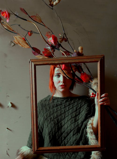 Woman Holding a Wooden Frame