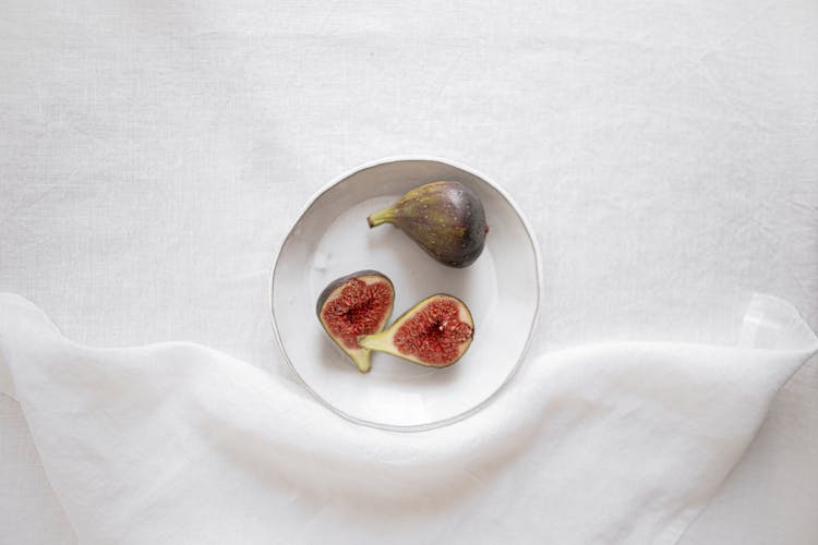 Fresh Healthy Figs Placed On White Plate