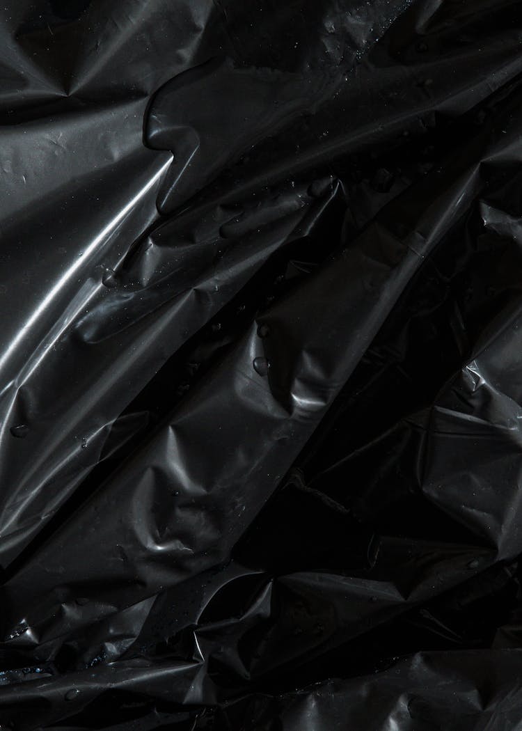 Background Of Black Crumpled Plastic Bag