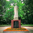 Concrete Statue Near Green Trees