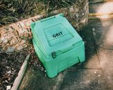 Container near stone barrier on street