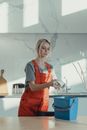 A Cleaner Holding a Rag
