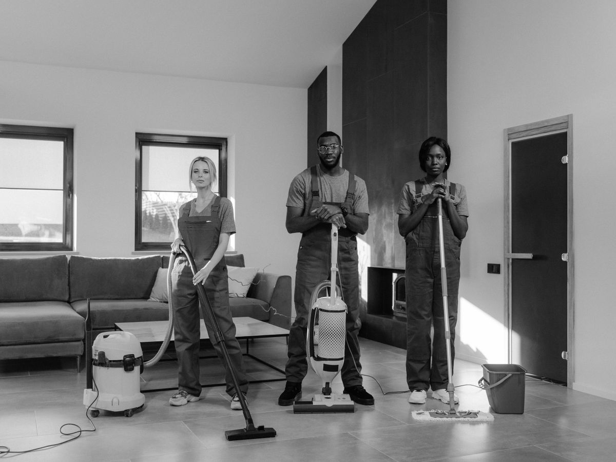 Cleaning crew with equipment in a commercial office