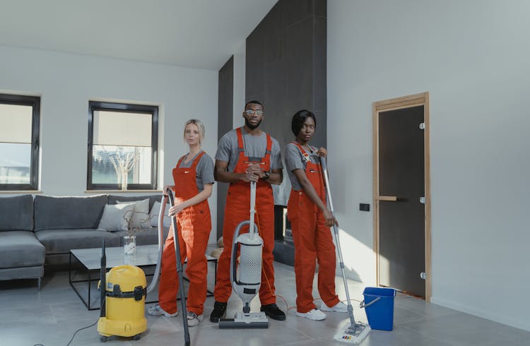 Cleaners In Orange Uniform