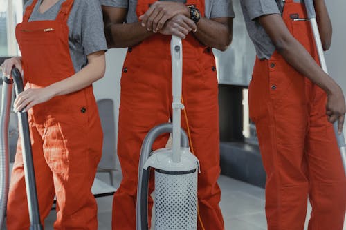 People Wearing Orange Coveralls