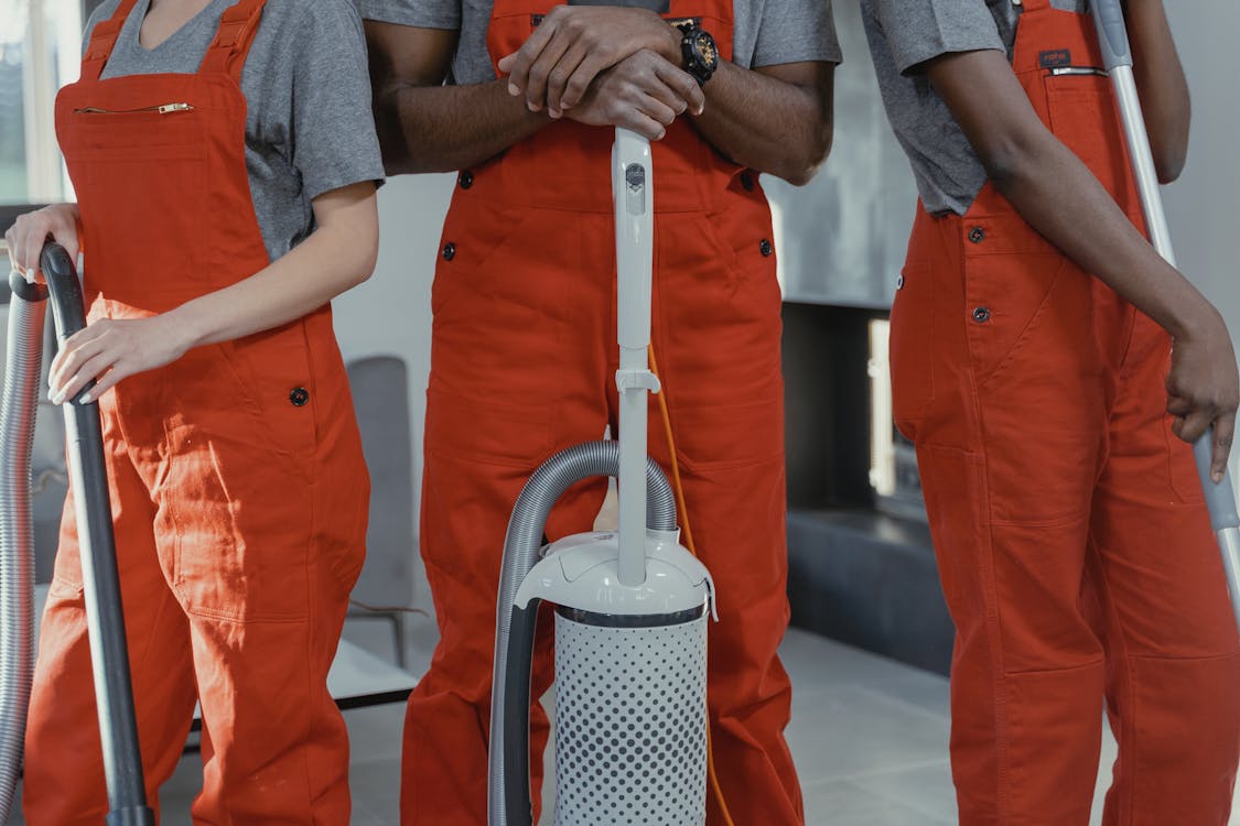 Free People Wearing Orange Coveralls Stock Photo