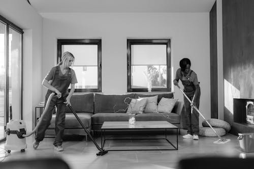 Free Women Cleaning Inside of a House Stock Photo