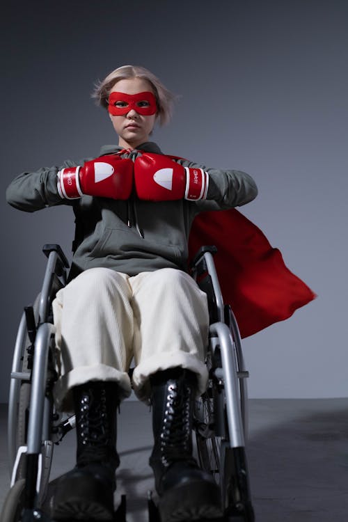Girl Wearing Costume Sitting on a Wheelchair