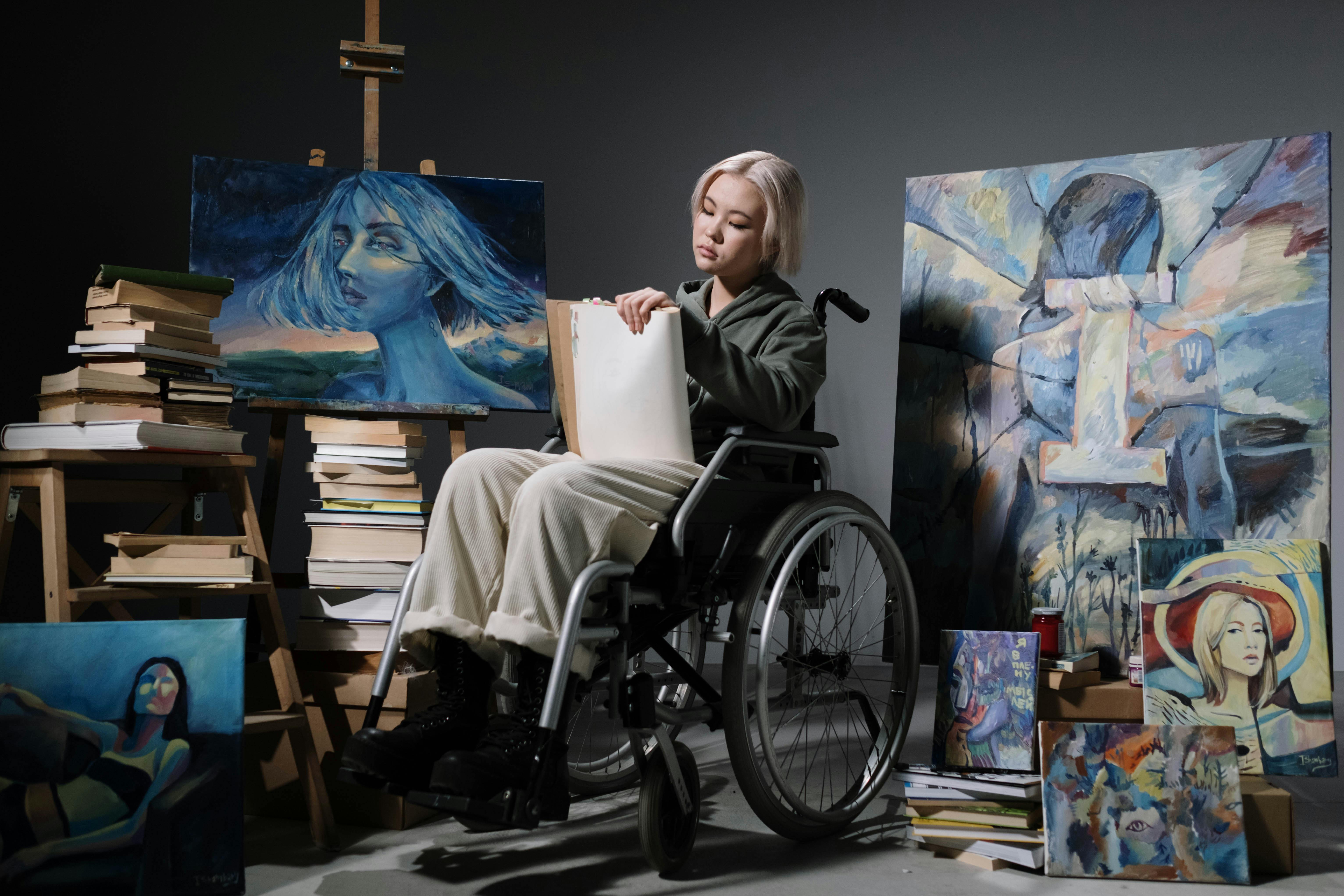 man in black jacket sitting on wheelchair