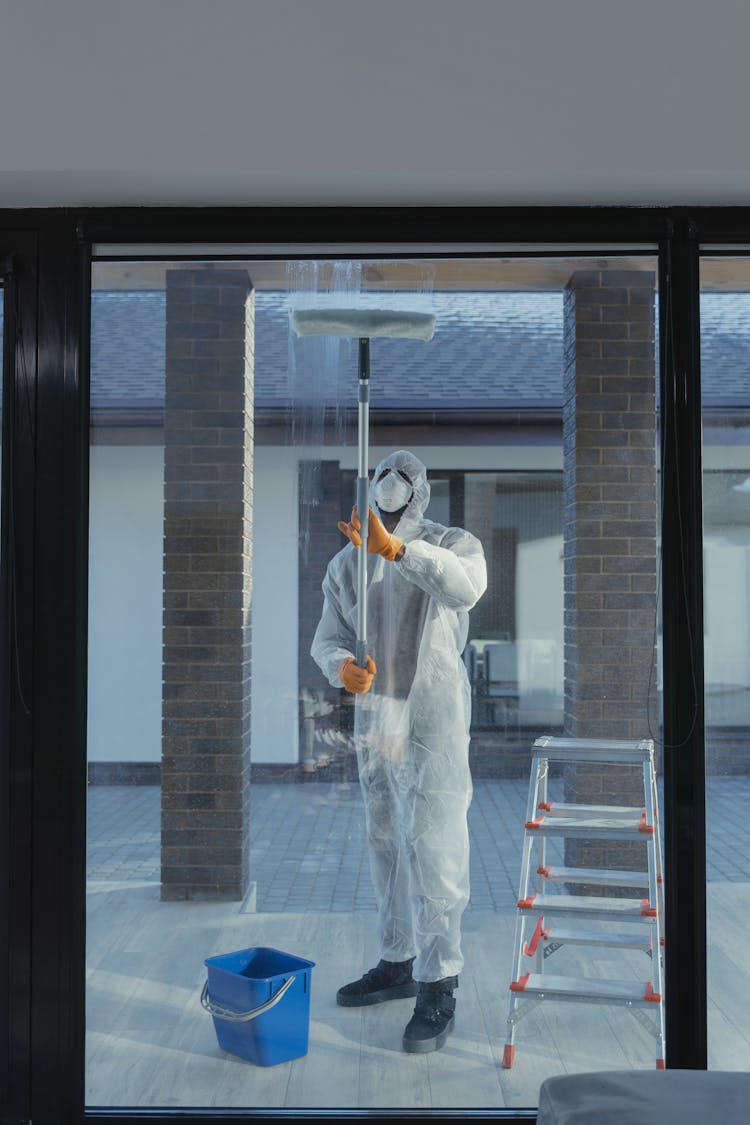 Man Cleaning Glass Window