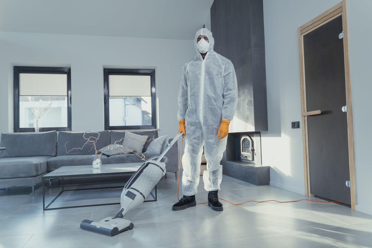 Protective cleaning technician with professional equipment