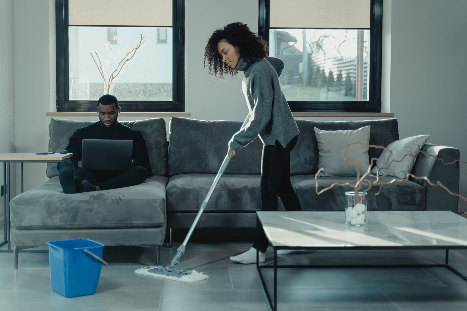 Mopping the floor in a contemporary living room