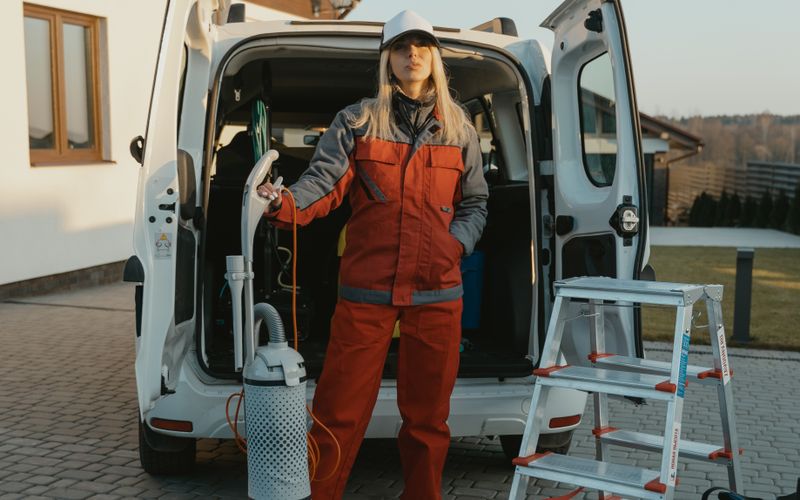 Professional cleaning team arriving at a home with equipment