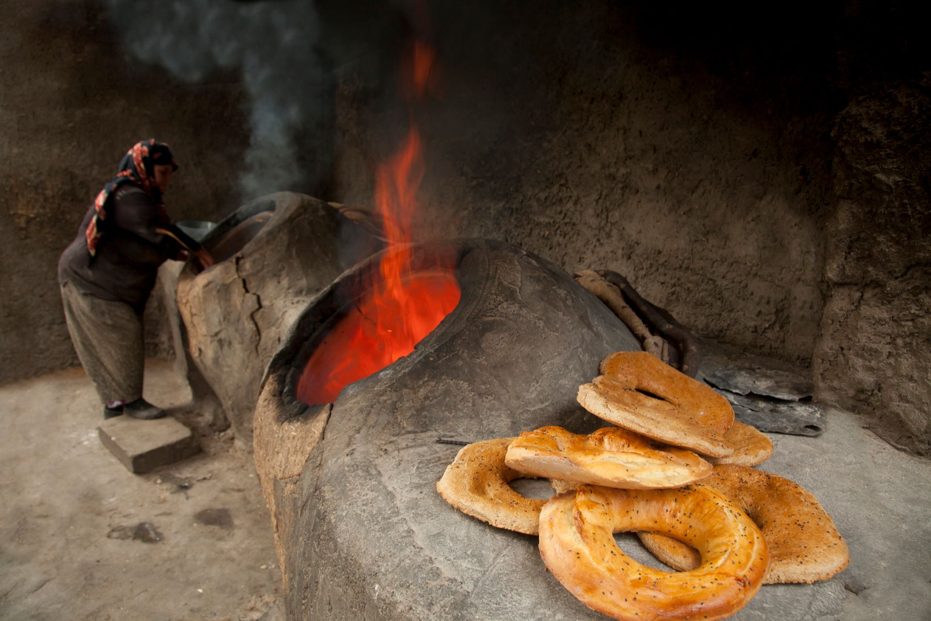 Authentic Turkish bread baking in a wood-fired stone oven, capturing the warmth and tradition.