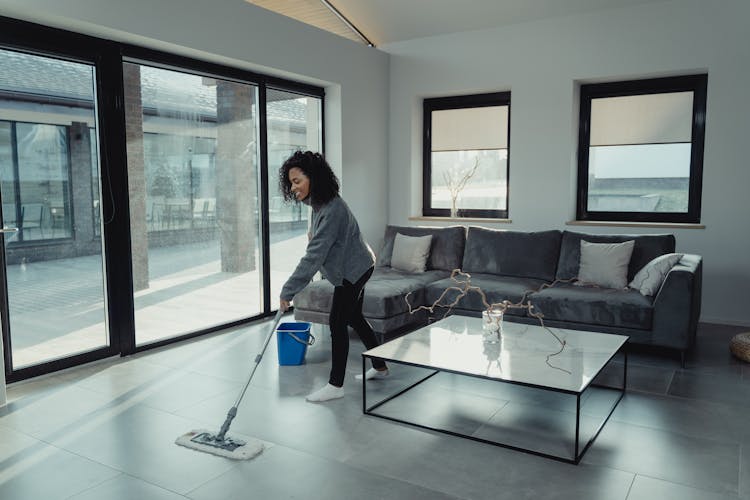 A Woman Cleaning The Floor 