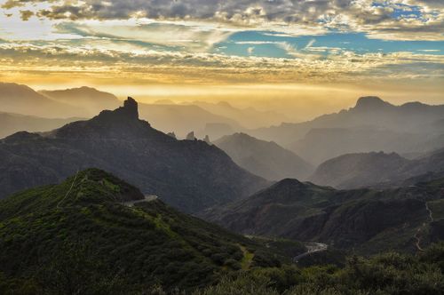 Free A breathtaking mountain landscape in Gran Canaria at sunset with scenic roads and peaks. Stock Photo