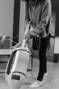 Person in Gray Coat and Black Pants Holding Gray and Black Handbag