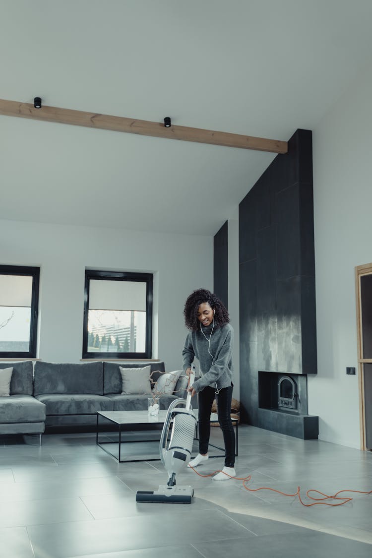 Woman Cleaning Her Living Room