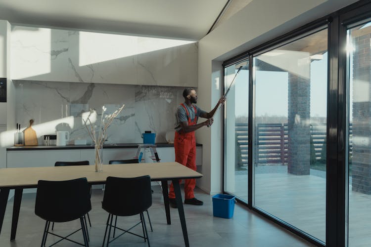 Man Cleaning The Windows